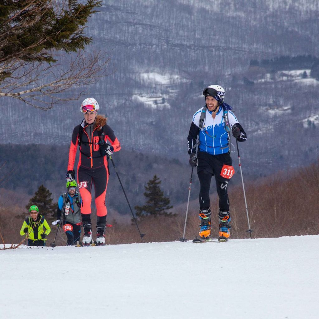 uphill skiers racing at bromley mountain
